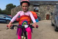 Liliana 'zooms off' on her bike to raise hundreds for Foodbank