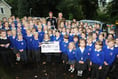 Pupils proudly show off school mosaic