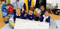 Pupils buoyant after RNLI cheque handover