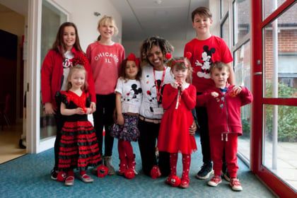 Children go red on catwalk for Comic Relief