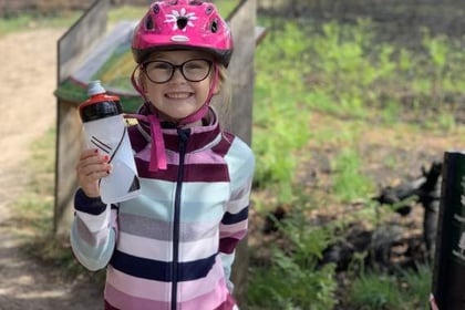 Schoolgirl Darcy, 6, rides 20km to support fire-hit common