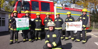 Firefighters complete arduous charity walk from Okehampton to Lynton