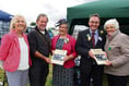 Winners presented with copies of new show books