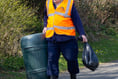 Schoolchildren help clean up the town streets