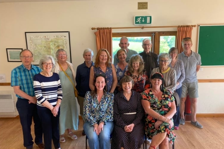 Tavistock Foodbank volunteer coordinator Linda Medland (seated in the middle) with volunteers at the cream tea to celebrate 10 years.