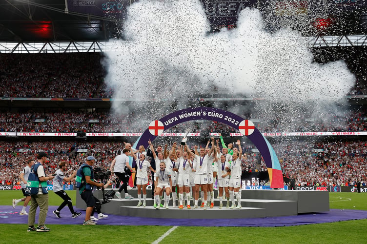 LONDON, ENGLAND - JULY 31: Leah Williamson and Millie Bright of England lift the UEFA Womenâs EURO 2022 Trophy after their sides victory during the UEFA Women's Euro 2022 final match between England and Germany at Wembley Stadium on July 31, 2022 in London, England. (Photo by Lynne Cameron - The FA/The FA via Getty Images)