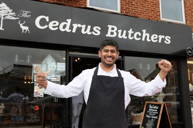 Tarique of Cedrus Butchers celebrate their Best Speciality Sausage victory at the Farnham Lions Cider and Sausage Festival