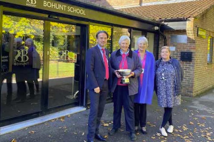 The Liphook Women’s Institute Centenary Cup is presented to Bohunt School in Liphook, October 2022. From left: Head Neil Strowger, WI president Judy Evans, WI secretary Muriel Bullingham and head of sixth form Clare Hodgson.