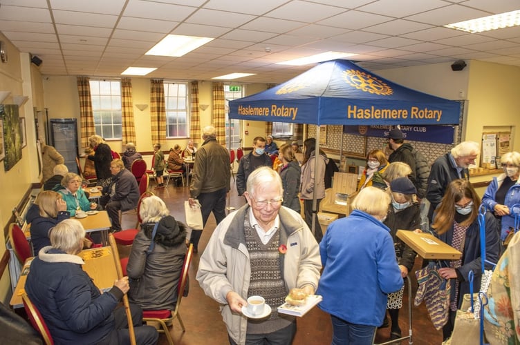 Haslemere Festival chairman Hamish Donaldson pictured carrying a cup of tea and a slice of cake at last year’s charities and craft fayre