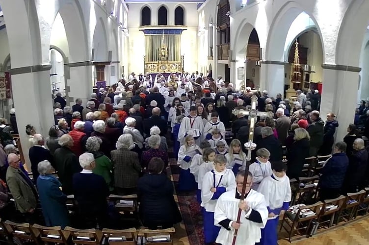 The induction of Revd Sandy Clarke as the new vicar of The Bourne parish opened with a splendid procession at St Thomas-on-The Bourne Church