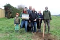 Residents plant their own apple orchard