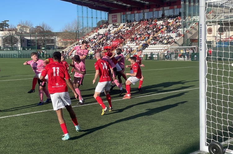 Farnham Town go close to scoring from a corner at Jersey Bulls