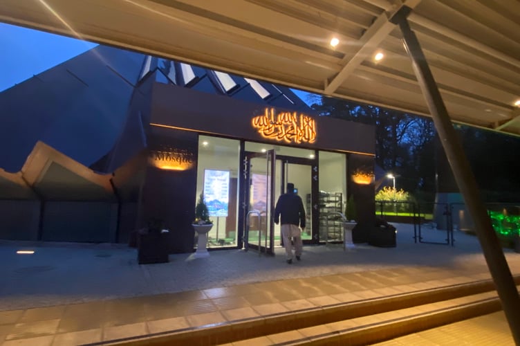 Ahmadiyya Muslims living at the Mubarak Mosque in Tilford answer the call to evening prayer during Ramadan