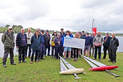 Frensham RC sailors negotiated choppy waters to deliver charity cheque