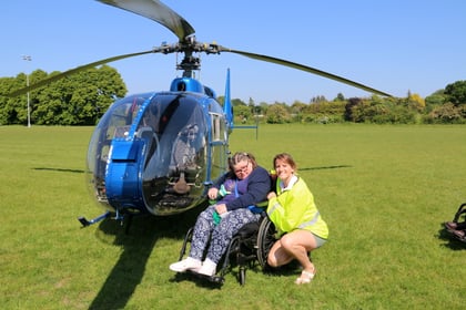 Disabled Woodlarks campers enjoy helicopter flights to Tilford