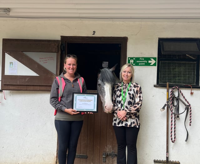 Treloar's presents certificate to Broadlands Riding for the Disabled