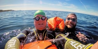 Pair complete charity swim against suicide