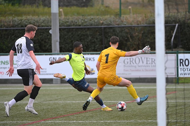 Calvin Camara shoots against the post for Knaphill at Alton, March 9th 2024.