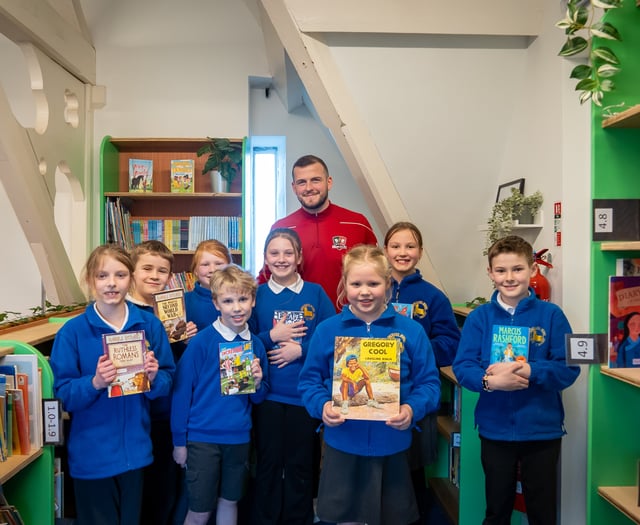 Exeter City FC Captain opens newly renovated school library
