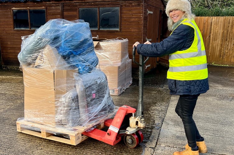 Emma transporting and unpacking the food donations.