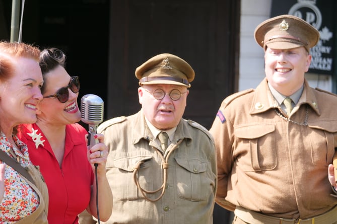 Stephanie Belle singing with some of the re-enactors