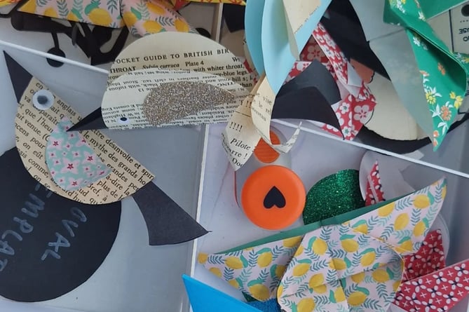 The children's birds, bugs and butterflies were made out of second hand books from Oxfam