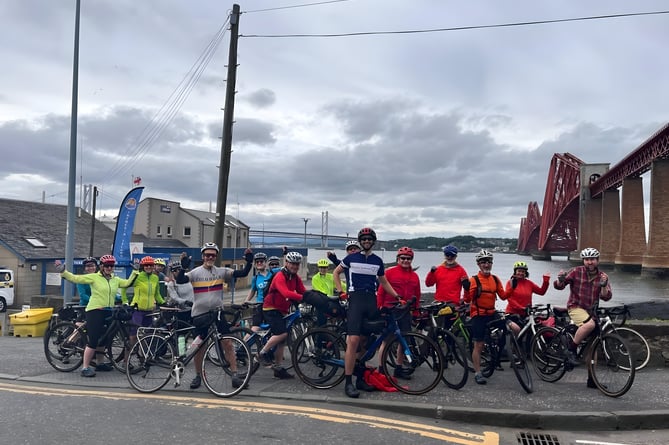 Archie with his supporters at the Forth Bridge in Scotland on day five. 