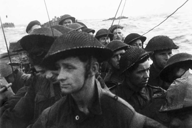Film still from the D-Day landings showing commandos aboard a landing craft on their approach to Sword Beach, 6 June 1944.