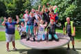 Primary school pupils help to paint play park