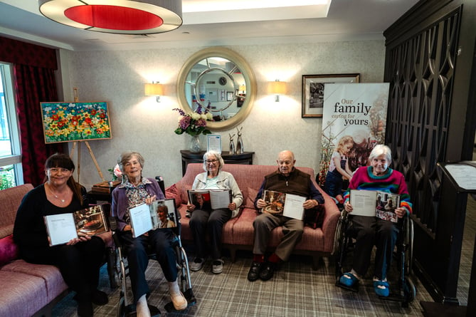 Janet, second left, with other residents and staff who have had recipes published