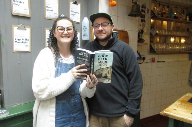 Becca and Luke Cassidy with the Good Beer Guide 2025, Cassidy's, High Street, Alton, October 2024.