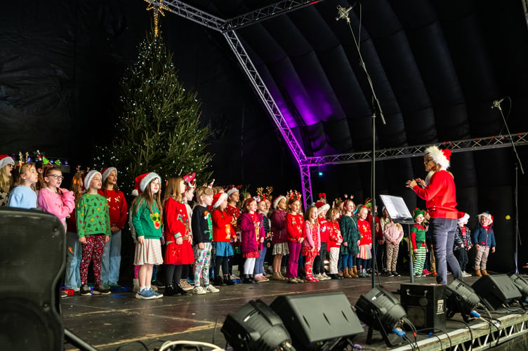 Children perform on stage at the Farnham Christmas lights switch-on event 2024
