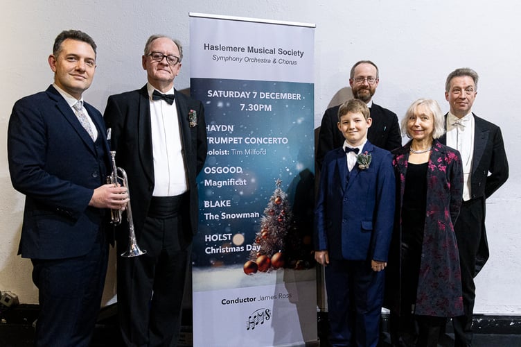 Haslemere Musical Society Christmas concert, Haslemere Hall, December 7th 2024. From left: Back - Tim Milford (trumpet), David Greenwood (narrator), Clive Osgood (composer) and James Ross (conductor). Front - Logan Broom (treble) and Clare Loosley (soprano soloist)