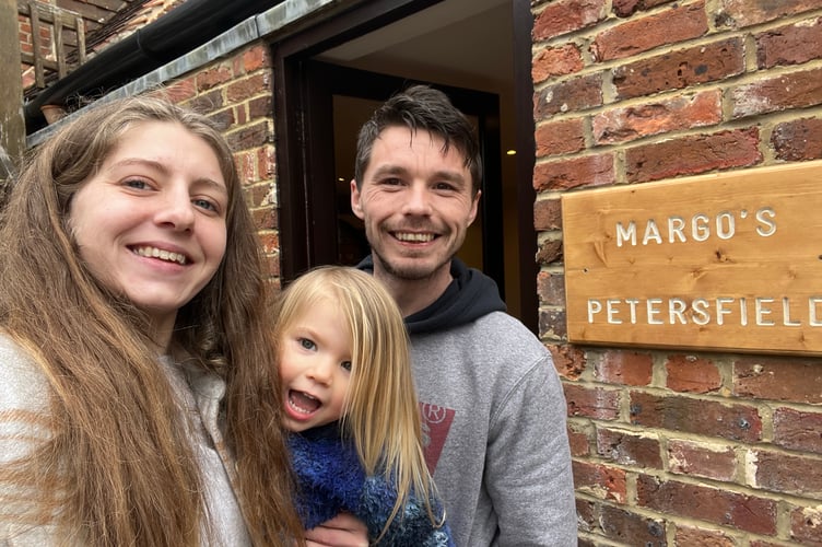 Margo with parents Jasmine and Barnaby outside the shop