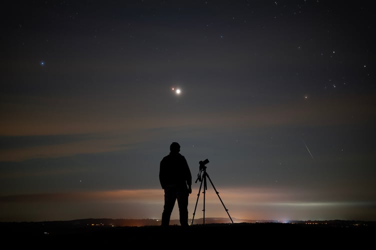 FILE PHOTO - Astro photographer Josh Dury. Photo released February 26 2025. All the planets in the solar system have been pictured together for the first time - from a field in Somerset. The landmark image was taken by a UK photographer during a rare planetary alignment. Josh Dury, 27, captured the spectacle of the solar system's planets aligning from the Somerset's Mendips Hills on Saturday (22 Feb). Experts have claimed it could be the first time all eight planets including Earth have been captured in a single image. Josh said: "I managed to capture a panorama image of the seven planets, AKA - the planetary parade. "It is made of nine images, revealing Saturn, Mercury and Neptune. However, they were very tricky to spot. I used multiple image analysis and astronomy apps to confirm their location. "As this was taken with a wide-angle lens, the nine images stitched to a panorama and a HDR blend of one of the frames to reveal Saturn, Neptune and Mercury. These three planets not easy to see at all."